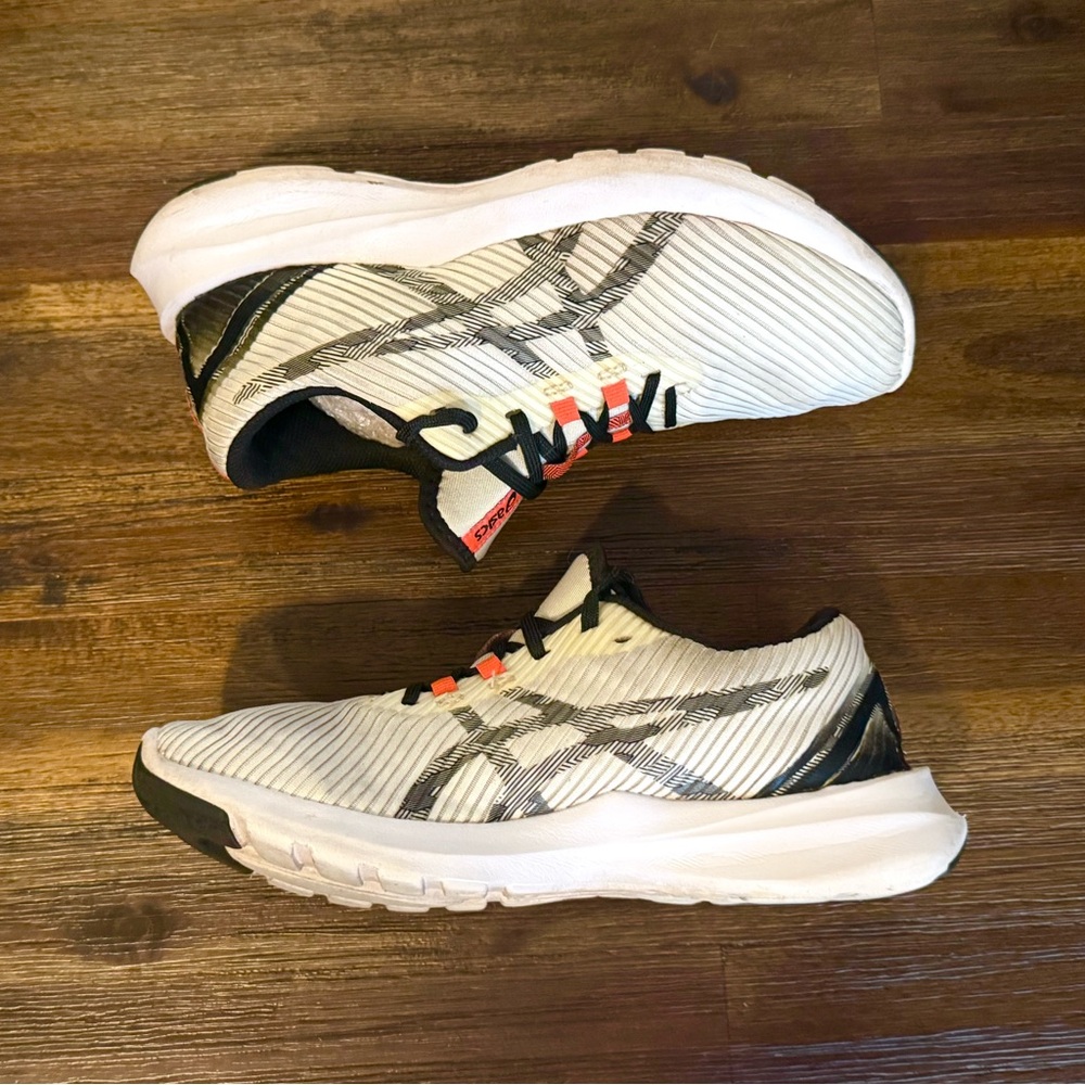 Asics White Athletic Running Shoes with Black and Orange Accents